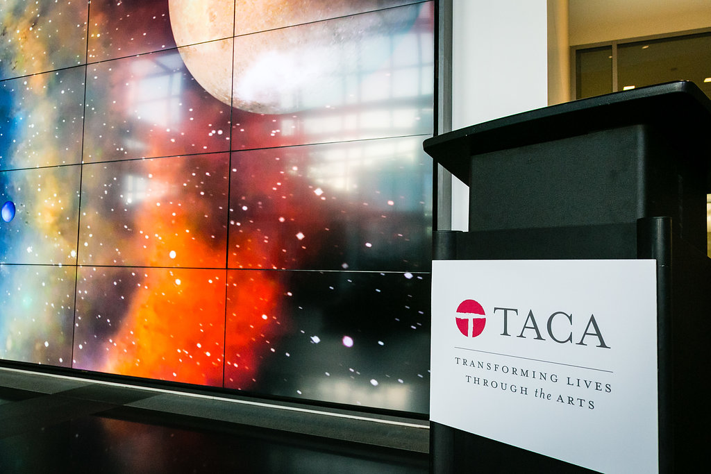 space-themed digital art and TACA podium