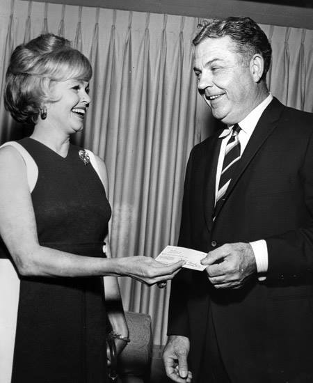 Jane Murchison Haber handing Dallas Theater Center Artistic Director TACA's first grant in 1967